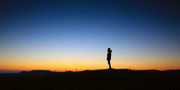 Person Standing In Sunset